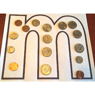 Use coins to build the letter m!