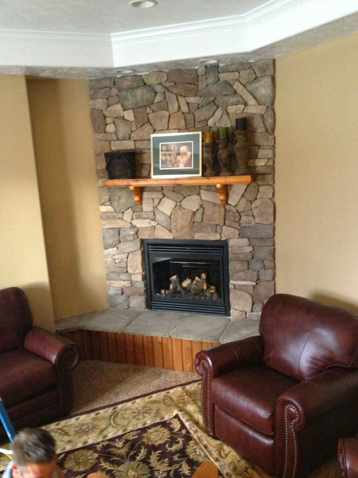 living room with fireplace and tv on opposite walls