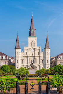 Iconic view of Saint Louis Cathedral with Jackson Square in the foreground (exterior)