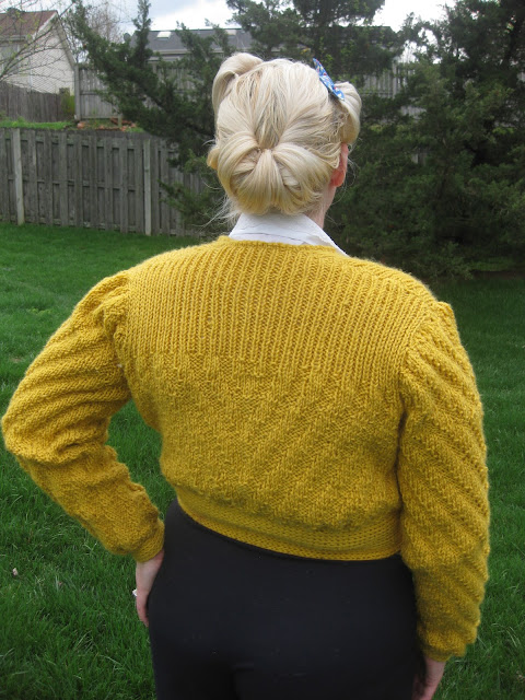 1940s date maker knitted cardigan and victory roll updo