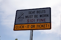 SEAT BELTS MUST BE WORN - $101 FINE - CLICK-IT OR TICKET!