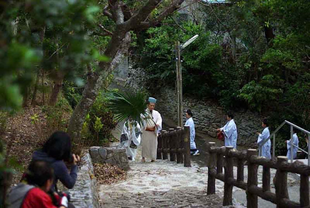 procession to shrine by costumed officials