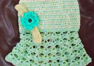 close up of the headband and strappy dress made for a baby by Sweet Nothings Crochet.  This is a free crochet pattern blog