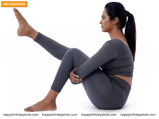 she is doing yoga in grey yoga outfit