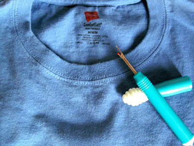 Use your favorite seam ripper to remove the ugly crew neck band.