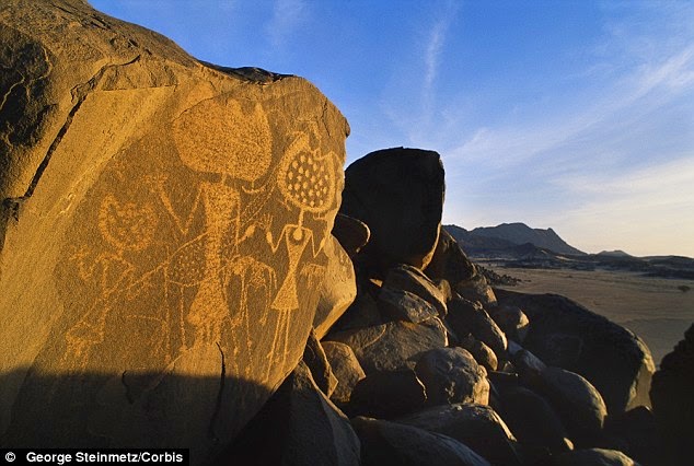 http://www.dailymail.co.uk/sciencetech/article-2634903/Have-aliens-visited-Earth-Nasa-book-suggests-ancient-rock-art-created-extra-terrestrials.html