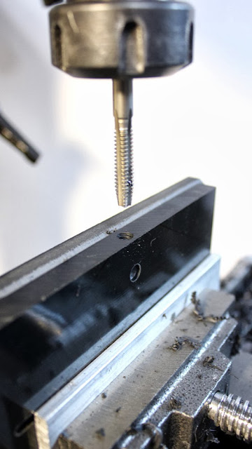 Mounting holes are threaded on the camera stabilizer head plate with the help of a 3-axis mill 