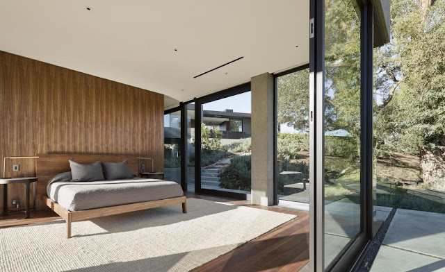 simple bedroom design with wood wall and floor