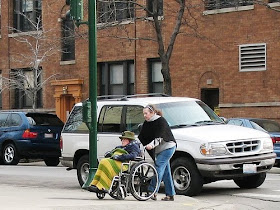 caregiving - helping elder in a wheelchair