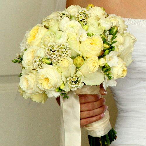 Simple but striking bridal bouquet containing soft yellow bright yellow and
