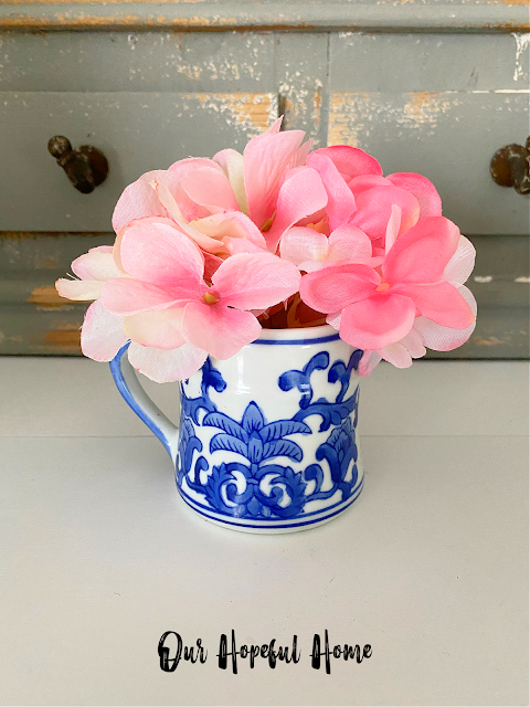 faux pink hydrangeas bouquet in creamer