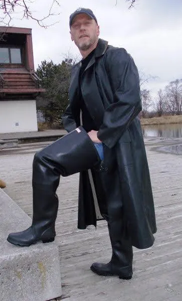 Man wearing black leather trench coat