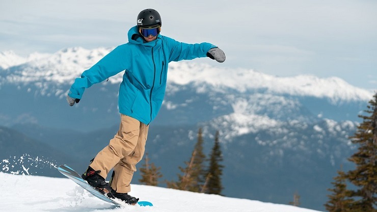 A man snowboarding