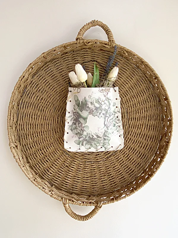 large basket with hanging flower pouch