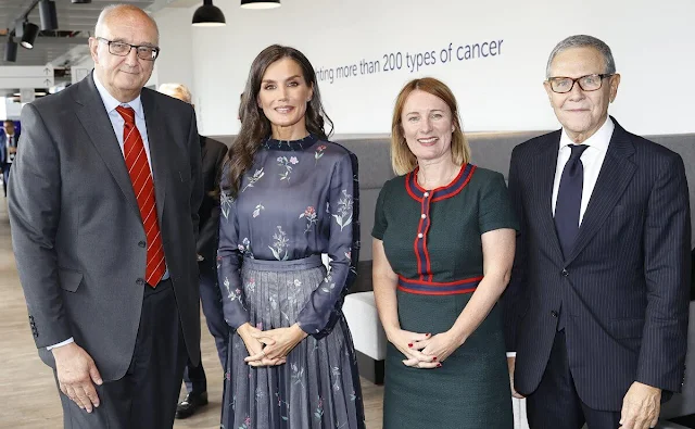 Queen Letizia wore a navy blue printed pleated evening dress by Giorgio Armani. World Cancer Research Day