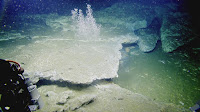 This is a large carbonate platform with intense bubble streams pouring out of the seafloor from under the carbonate cap. (Credit: Oregon State University) Click to Enlarge.