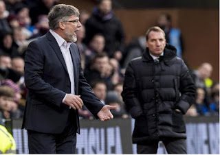 Craig Levein shouting while an unimpressed Brendan Rodgers looks on