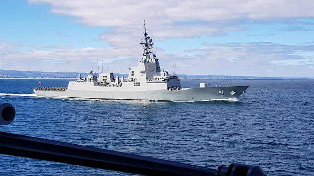 Image Attribute: NUSHIP Brisbane at sea during builders trials viewed from her sister ship, HMAS Hobart / Source: Royal Australia Navy (RAN)