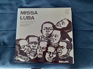 The sleeve of Missa Luba, showing the heads of eight people