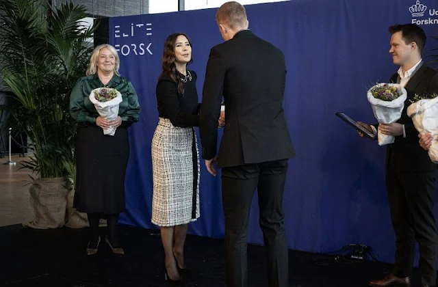 Crown Princess Mary wore a crystal collar crepe blouse by Red Valentino, and a tweed high waisted skirt by Dolce and Gabbana