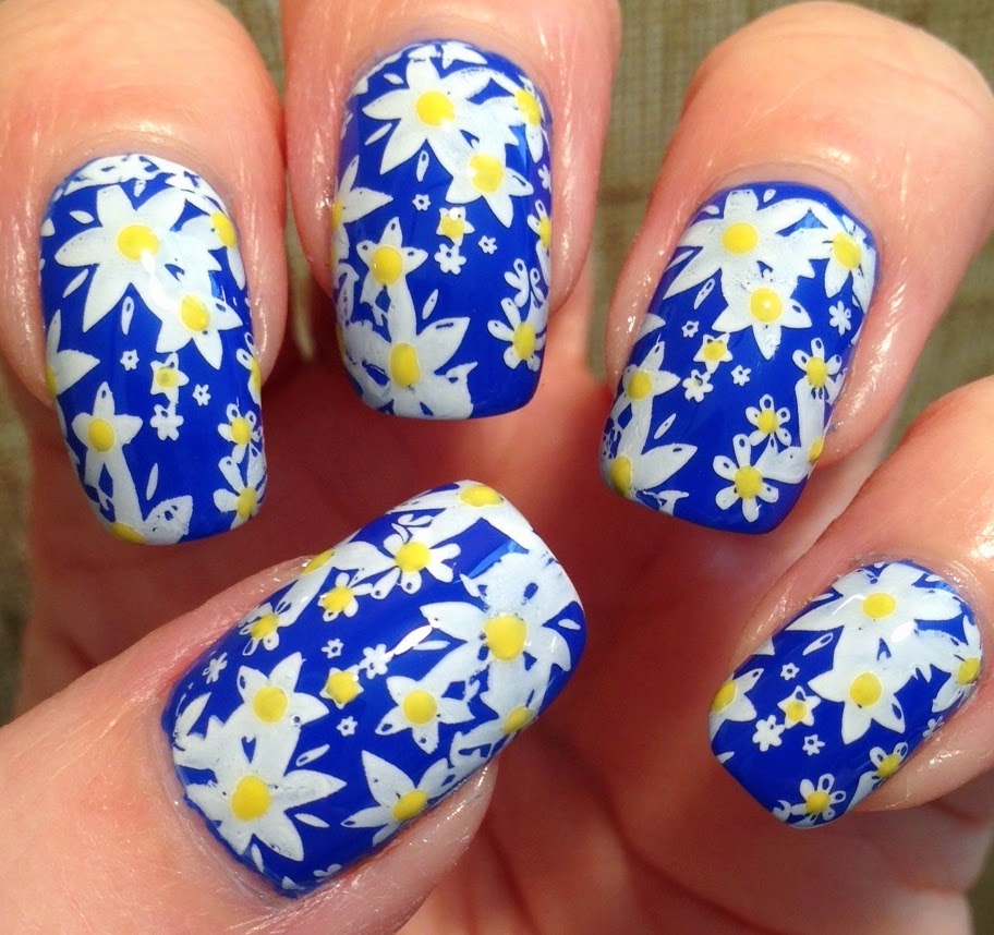 Your Nails Deserve These Floral Designs : White Daisy + Side Blue Nails