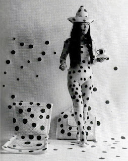 Yayomi Kusama in a hat and in circles