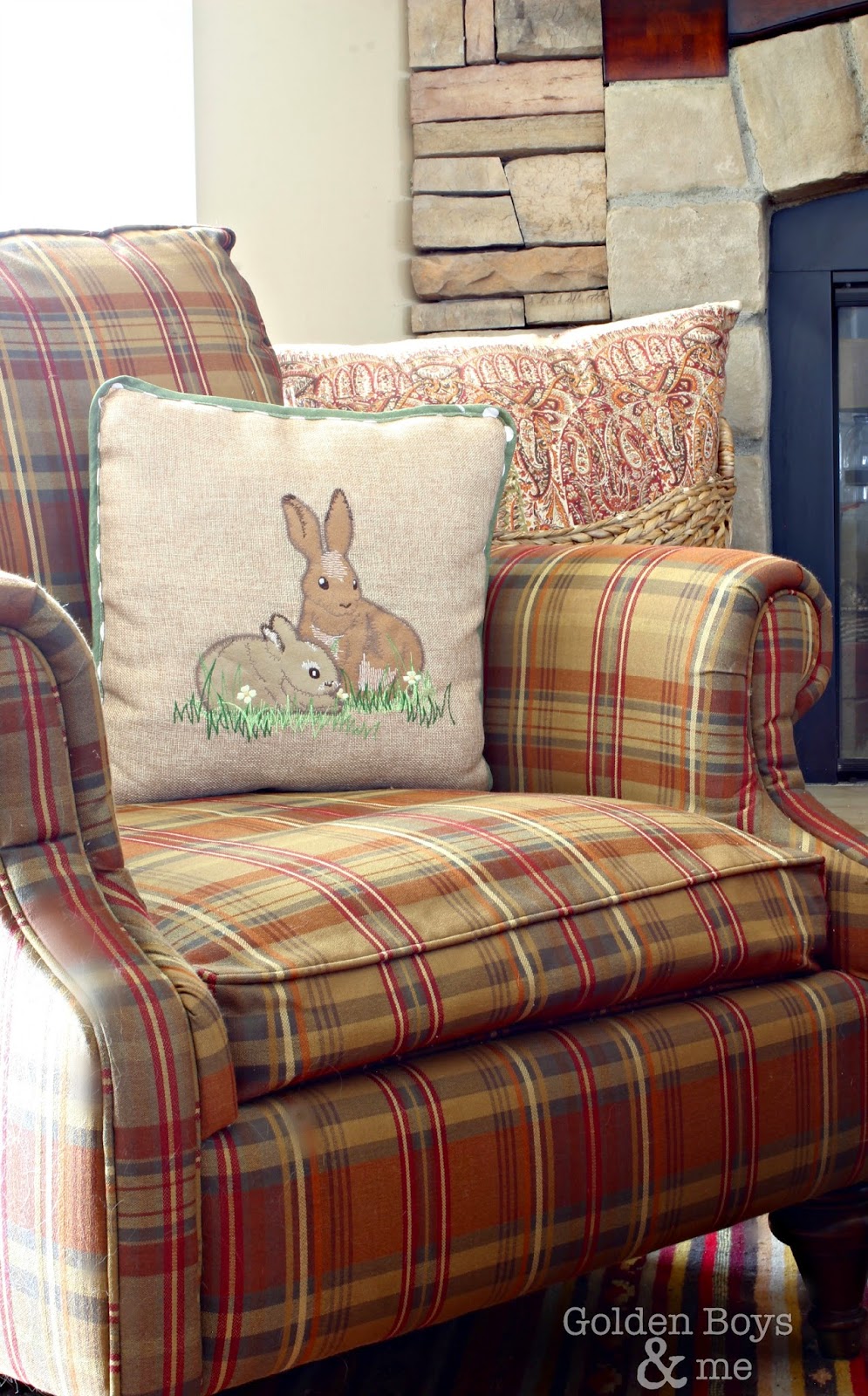Bunny pillow on plaid chair in Spring family room-www.goldenboysandme.com