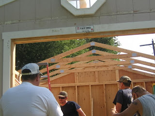 And here the guys are putting on a new roof, using plywood from Shane 