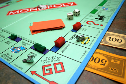 begin to play a game of Monopoly