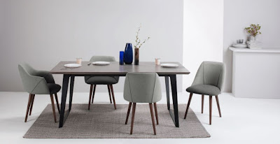 Comfortable gray dining room with retro dining chairs