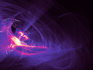 Abstract light painting using particles to create a galaxy effect in purples and pinks against a black background.,