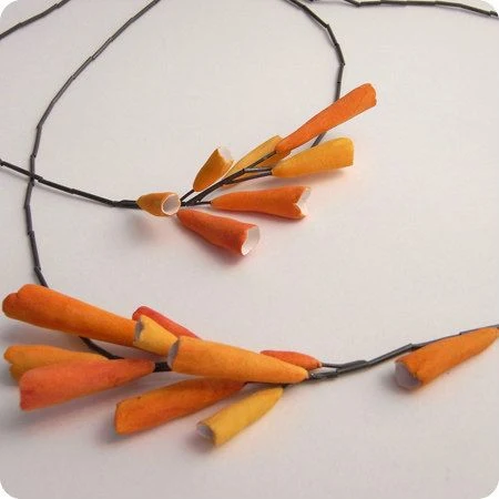 handmade orange paper necklace on black necklace