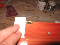 Set the hinges in 1 inch from each side of the case bottom