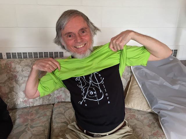 Proud to be a Stairweller tenor, David Rain shows off his new SC T-shirt