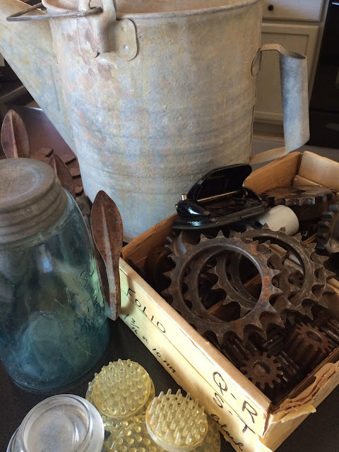 Now you know I nearly ran across the yard to dive for this ball jar! They aren't easy to find here, but what about the rusty metal gears and the watering can?