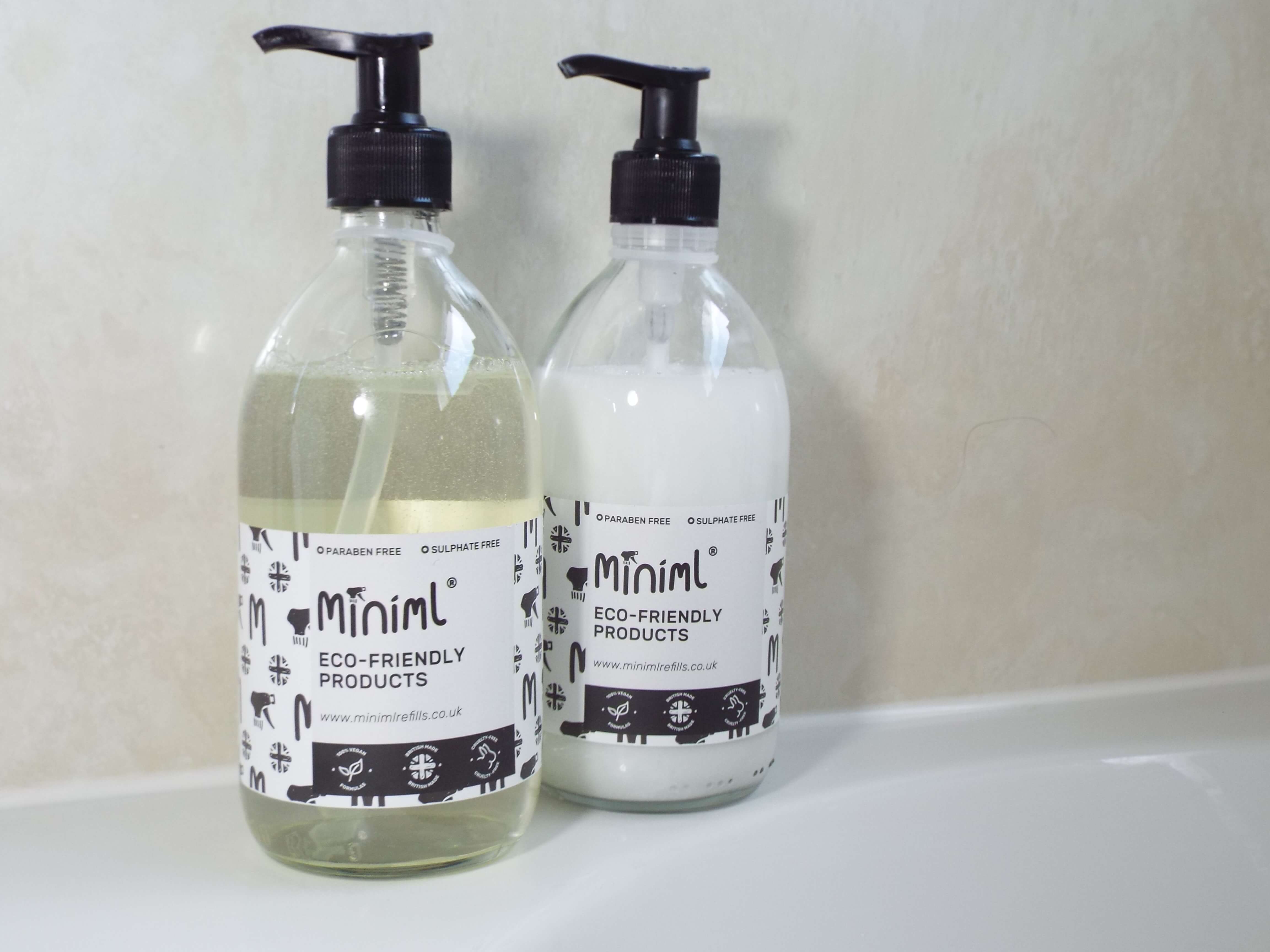 Minimal shampoo and conditioner sat on bath tub.