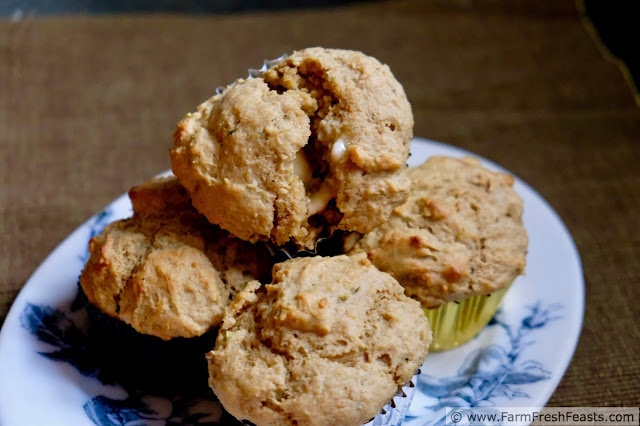 a plate of savory muffins flavored with garlic scape pesto and ricotta cheese