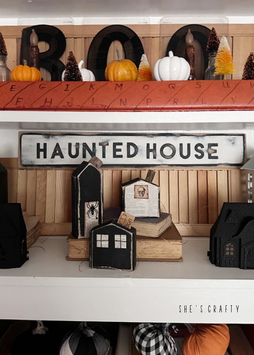 Haunted House Sign and scrap wood haunted houses.