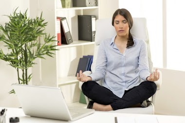 8 Yoga Poses You Can Do in Your Desk Chair