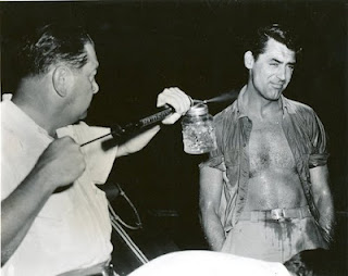 Cary Grant being sprayed