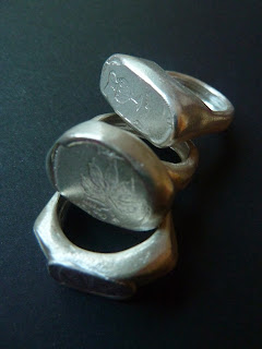 large silver rings with symbols from old juda coins