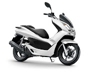 PCX Honda 125 with a plain white color with no striping looks elegant and .