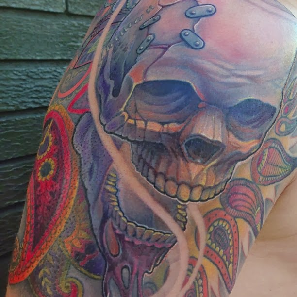 Human Skull with paisleys tattoo