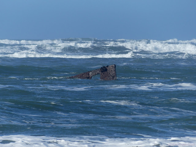 fin of metal sticking out of the waves