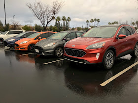 2020 Ford Escape Titanium AWD with three Ford Fiesta STs