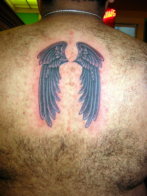 Angel wings cross tattoo on upper arm and angel wings cross tattoo on upper