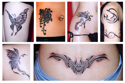 butterfly tattoos on upper back. last name tattoo on upper back