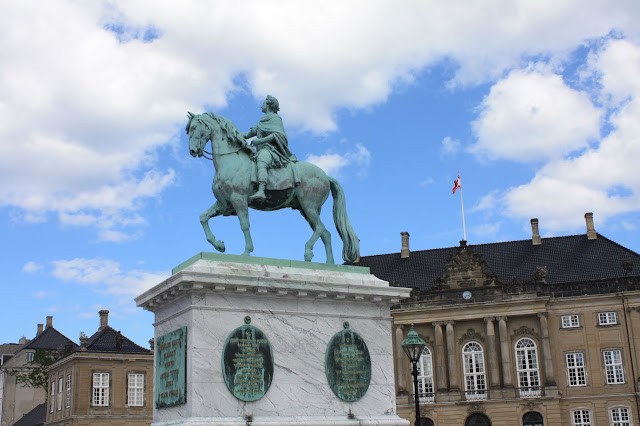 King Frederik V rises above the courtyard at Amalienborg Palace