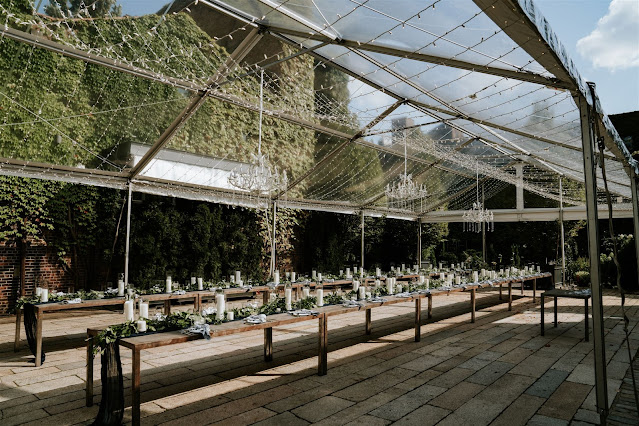 Icicle / Fairy Lights with Crystal Chandelier suspended under a clear top tent for a summer wedding at The Foundry.