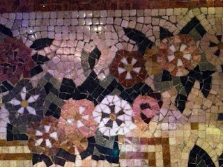 Glistening mosaic stones form floral focal points throughout the Bellagio's lobby  and conservatory areas/